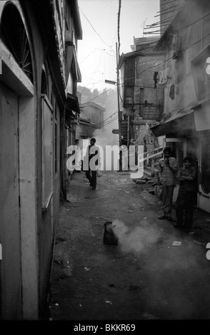 With the sun still yet to rise, small fires fill Sabzi Mandi, the Lower Bazar in Shimla, with a fog of acrid smoke Stock Photo