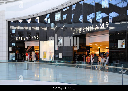 Debenhams retail business & department store entrance Westfield shopping mall interior Shepherds Bush West London England UK Stock Photo