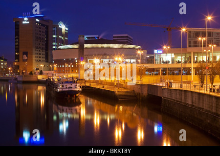 The Waterfront Hall and Laganside office blocks reflected in the waters of the River Lagan, Belfast, Northern Ireland Stock Photo