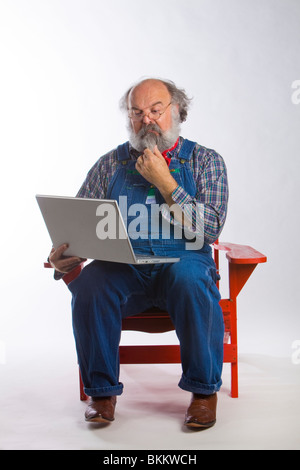 One man working on a laptop computer Stock Photo