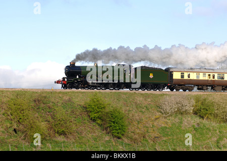 Preserved steam locomotive pulling main line excursion train, UK Stock Photo