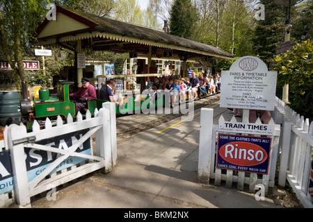 Miniature / model narrow gauge locomotive railway steam train and station at Brookside Garden Centre, Poynton. Cheshire. UK. Stock Photo