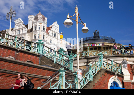 Seaside people use steps on Brighton's steps near the West Pier. Stock Photo