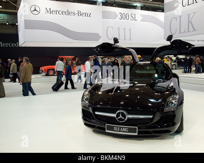 The new SLS AMG gullwing Mercedes on display at Techno Classica in Essen, Germany with red 300SL in the background. Stock Photo