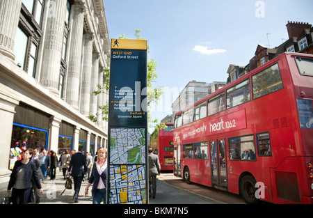 Buses outside Selfridges store, Oxford Street, London UK Stock Photo