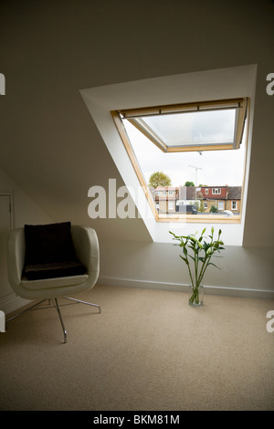 Velux window in a dormer roof / attic / loft conversion, in a Victorian terraced house in Twickenham. UK Stock Photo