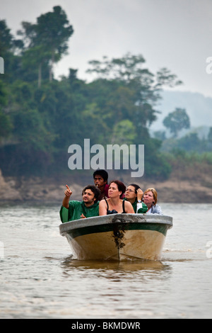 Eco tourists on a wildlife cruise on the Kinabatangan River, Sabah, Borneo, Malaysia. Stock Photo