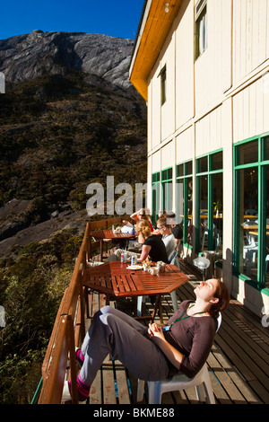 Hiker relaxing at Laban Rata resthouse on Mt Kinabalu. Kinabalu National Park, Sabah, Borneo, Malaysia. Stock Photo