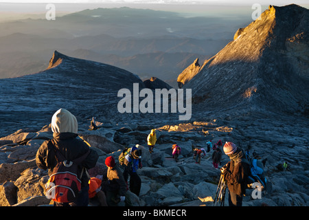 Climbers at the summit of Mt Kinabalu, at Low's Peak. Kinabalu National Park, Sabah, Borneo, Malaysia. Stock Photo