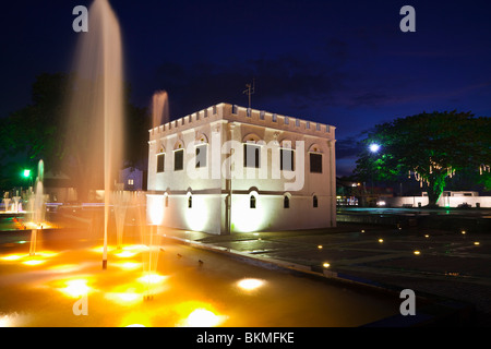 The Square Tower - built by Charles Brooke in 1879 as a fort - illuminated at night. Kuching, Sarawak, Borneo, Malaysia. Stock Photo