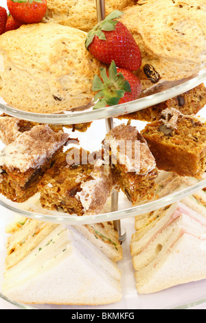 cake stand with Strawberries and scones, Walnut cake sponge, ham and egg sandwiches desert Wedding breakfast table Rufford wedding facilities, Rufford Mill Stock Photo