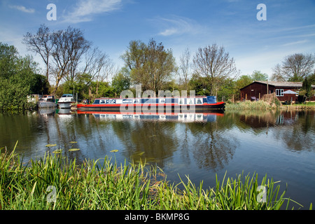 The River Ouse A Longboat Barge Near Houghton Village In Cambridgeshire, East Anglia England The United Kingdom UK Stock Photo