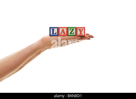 Woman holding children's blocks that spell 'LAZY' Stock Photo