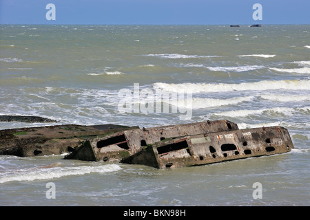 World War Two Phoenix caissons to form an improvised Mulberry harbor at Gold Beach during  WW2 at Arromanches, Normandy, France Stock Photo