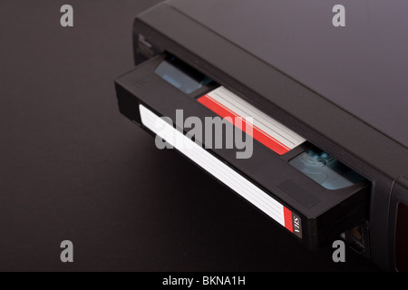 Old Video Cassette Recorder ejecting tape Stock Photo