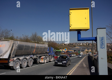 car passing yellow speed traffic camera on a road in Buxton Derbyshire England UK Stock Photo