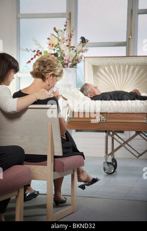 The Deceased Laying In A Coffin At A Funeral Stock Photo