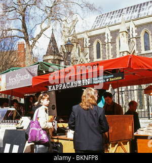 Customers buying toasted cheese sandwiches at Kappacasein stall at Borough Market London England UK  KATHY DEWITT Stock Photo