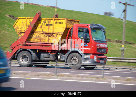 Skip lorry  on the M62 motorway. Stock Photo