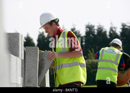 Building apprentices on a building site Stock Photo