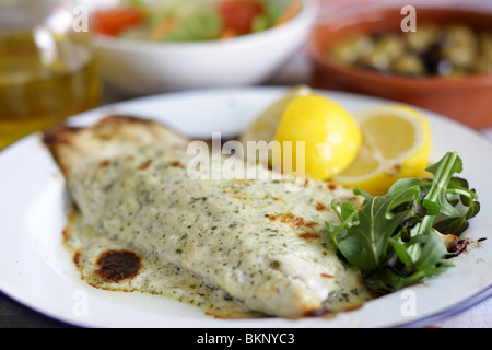 Authentic Cooked Fresh Sea Bass Fillet In Chervil Sauce Served On A Plate With No People Stock Photo