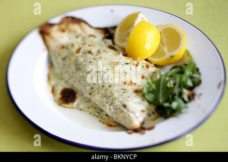 Authentic Cooked Fresh Sea Bass Fillet In Chervil Sauce Served On A Plate With No People Stock Photo