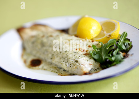 Authentic Cooked Fresh Sea Bass Fillet In Chervil Sauce Served On A Plate With No People Stock Photo