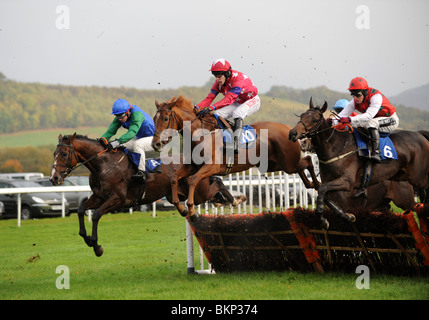 Horse racing over hurdles at Ludlow Race Course in Shropshire Uk Stock Photo