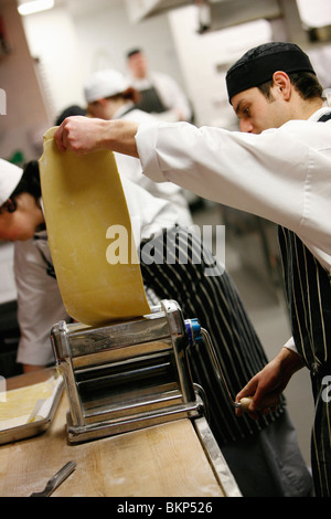 Chef preparing fresh pasta in a restaurant kitchen Stock Photo