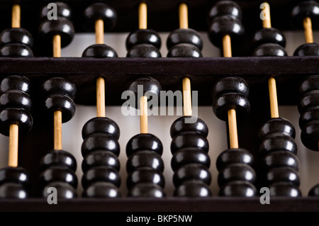 Old vintage wooden abacus on white background. Stock Photo