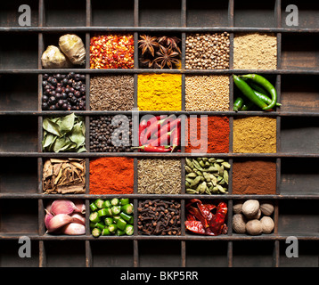Indian cooking spices in an old wooden tray. Flat lay photography from above Stock Photo