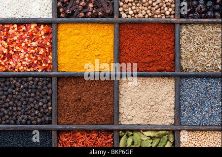 Indian spices in an old wooden tray. Flat lay photography from above Stock Photo