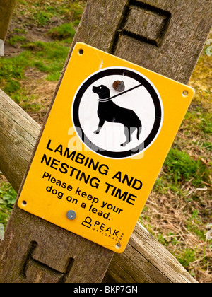 Lambing and Nesting Time warning sign to dog owners in the Peak District National Park England UK Stock Photo