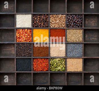 Indian spices in an old wooden tray. Flat lay photography from above Stock Photo