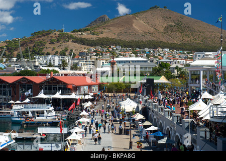 People walking through the waterfront in Cape Town, South Africa.