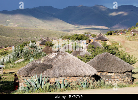 Traditional Basotho rondoval house made of stone with a thatch roof in Lesotho, Southern Africa Stock Photo