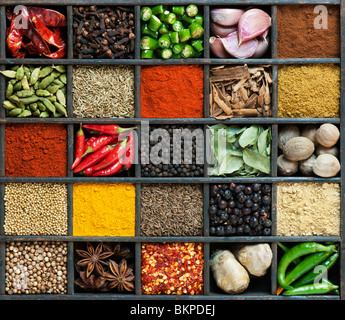 Indian cooking spices in an old wooden tray. Flat lay photography from above Stock Photo