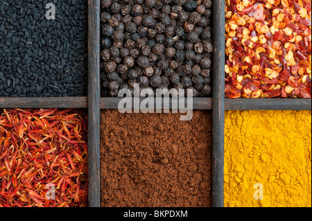 Indian spices in an old wooden tray Stock Photo