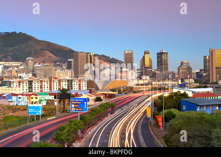 Early morning view of traffic trails on Eastern Boulevard leading into the city of Cape Town, South Africa. Stock Photo