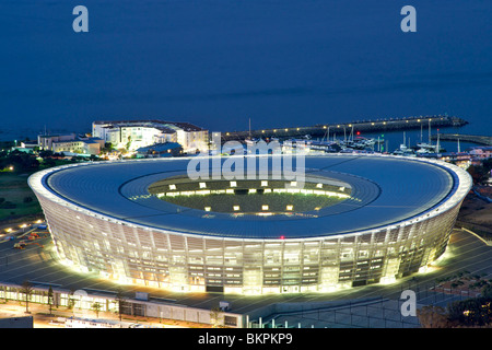 Dusk view of the new FIFA 2010 stadium in Green Point, Cape Town with Table Bay in the background. Stock Photo