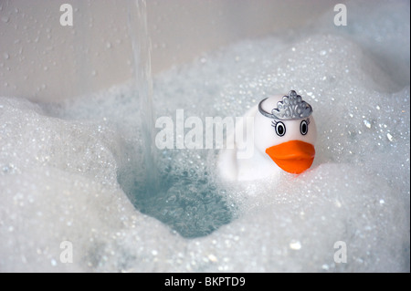 Rubber Duck in Running Bubble Bath Stock Photo