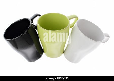 Three white green and black coffee cups in an arc isolated on white Stock Photo