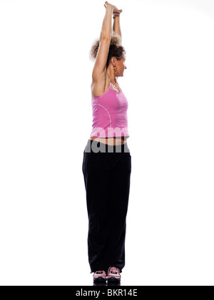 beautiful mature woman on isolated white background doing stretching exercise Stock Photo