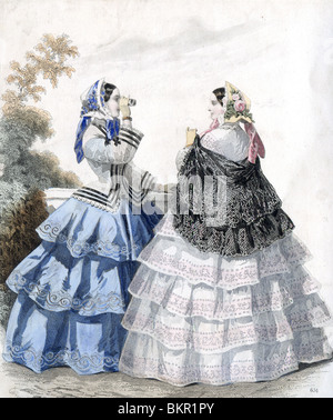 Two Women in Traditional Victorian Costumer with Binoculars Stock Photo