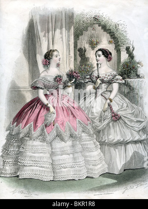Two Women in Traditional Victorian Cosutme in the Courtyard Stock Photo
