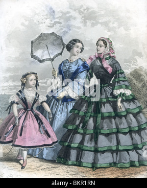 Two Woman in Traditional Victorian Costume with Young Girl Stock Photo