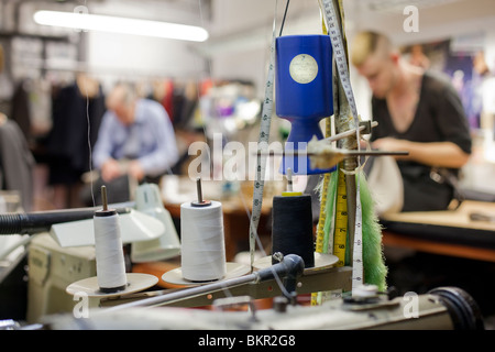 Tailors in the workshop of Henry Poole. Savile Row, London. Stock Photo