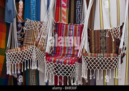 Ecuador, Market stalls selling brightly-coloured, locally-made hanging chairs at Otavalo. Stock Photo