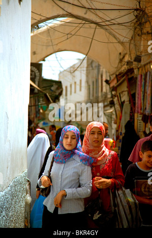 Libya; Tripolitania; Tripoli; Two veiled girls walking through the 'suq' in Tripoli's Ancient Medina Stock Photo