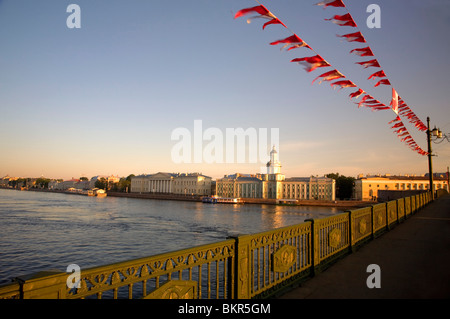 Russia, St.Petersburg; Across the Neva River early morning with the Kunskamera visible and flags in the foreground Stock Photo